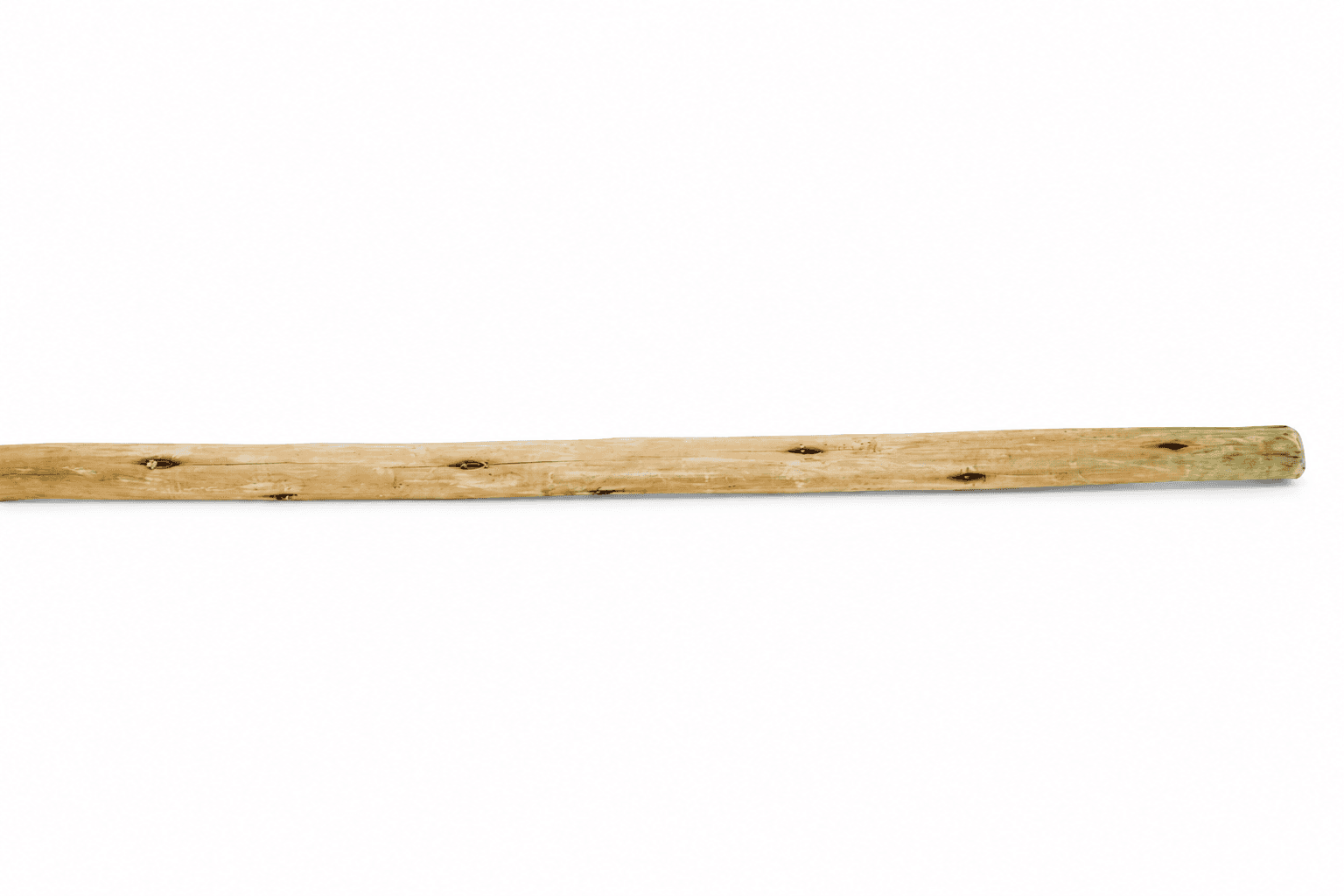 Pine Tapered Poles, a full pole laid flat showing the taper along its length
